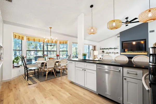 a kitchen with a refrigerator and a table
