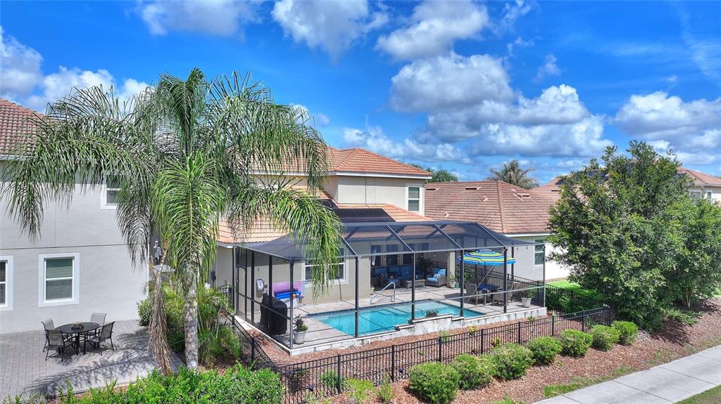 1089 Blackwolf Run Road Davenport, FL 33896 - Photo 3 of 82 a front view of a house with a garden