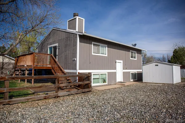 a front view of house with yard and car parked