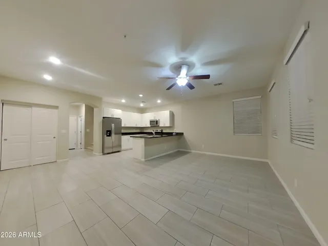 a view of a kitchen with a sink and a stove top oven