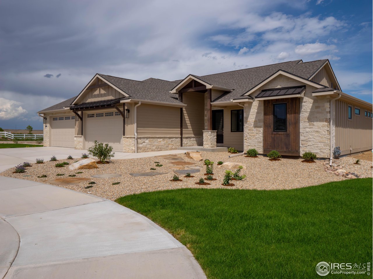 3806 Bridle Ridge Circle Severance, CO 80524 - Photo 12 of 13 a front view of a house with a yard and garage