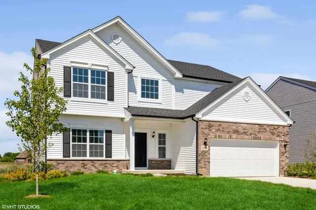 front view of a house with a yard