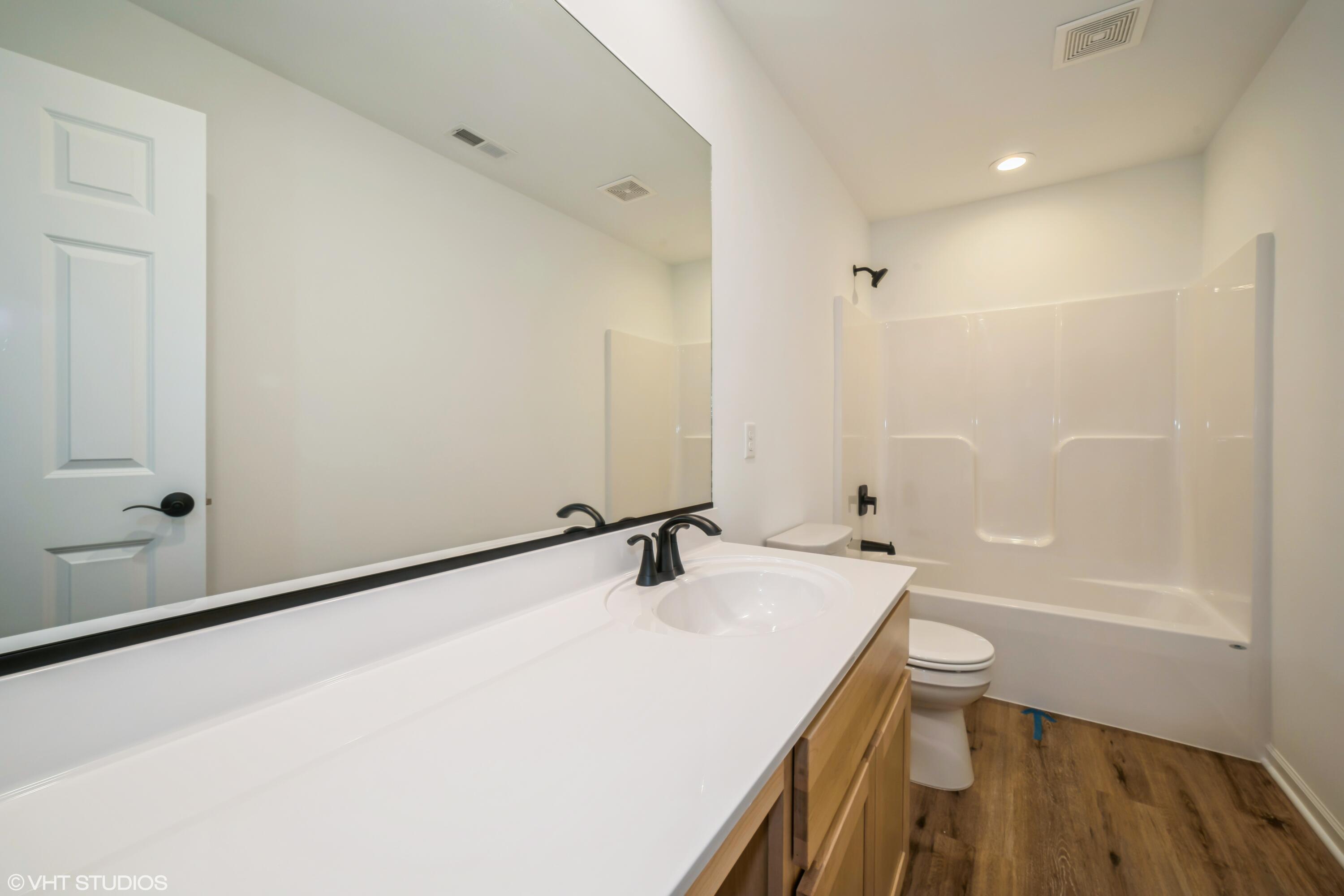 2885 East 105th Avenue Crown Point, IN 46307 - Photo 26 of 30 a bathroom with a sink and a mirror
