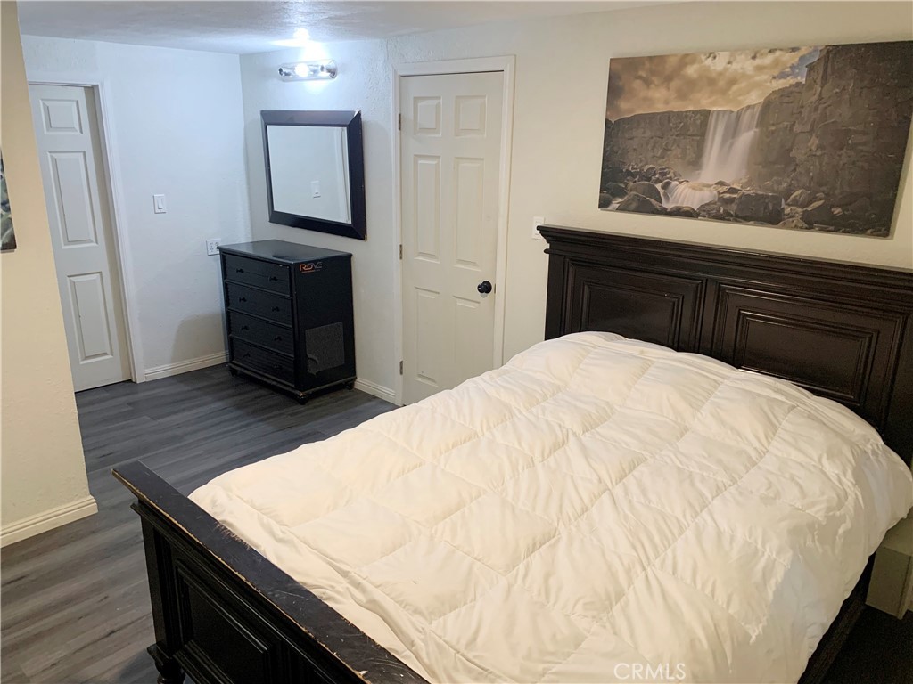 20415 Myron Street Perris, CA 92570 - Photo 14 of 29 a bed sitting in a bedroom and mirror