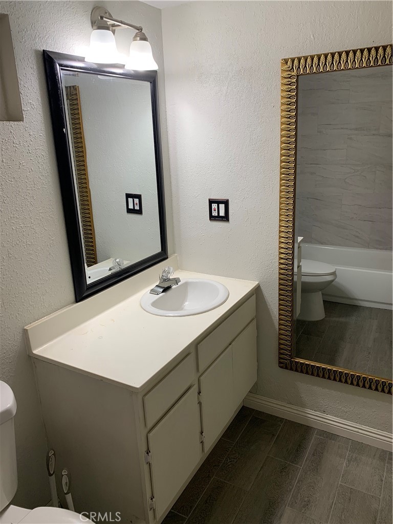 20415 Myron Street Perris, CA 92570 - Photo 17 of 29 a bathroom with a sink a mirror and a shower