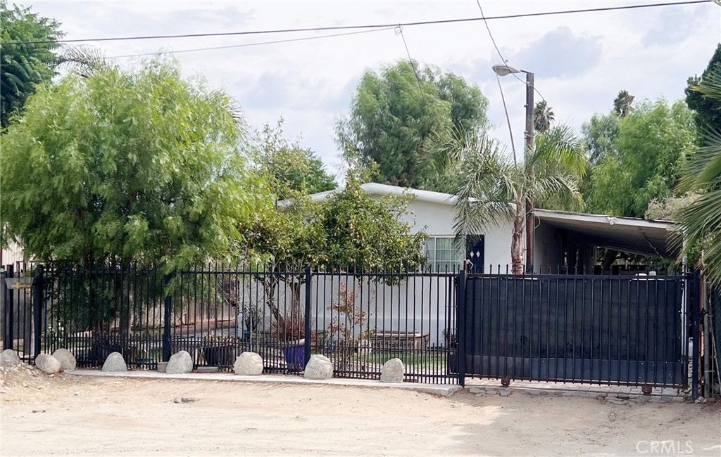 20415 Myron Street Perris, CA 92570 - Photo 2 of 29 a view of a house with a wooden fence