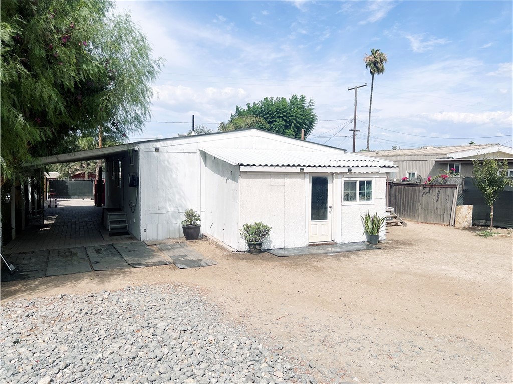 20415 Myron Street Perris, CA 92570 - Photo 22 of 29 a blue and white house with a outdoor space