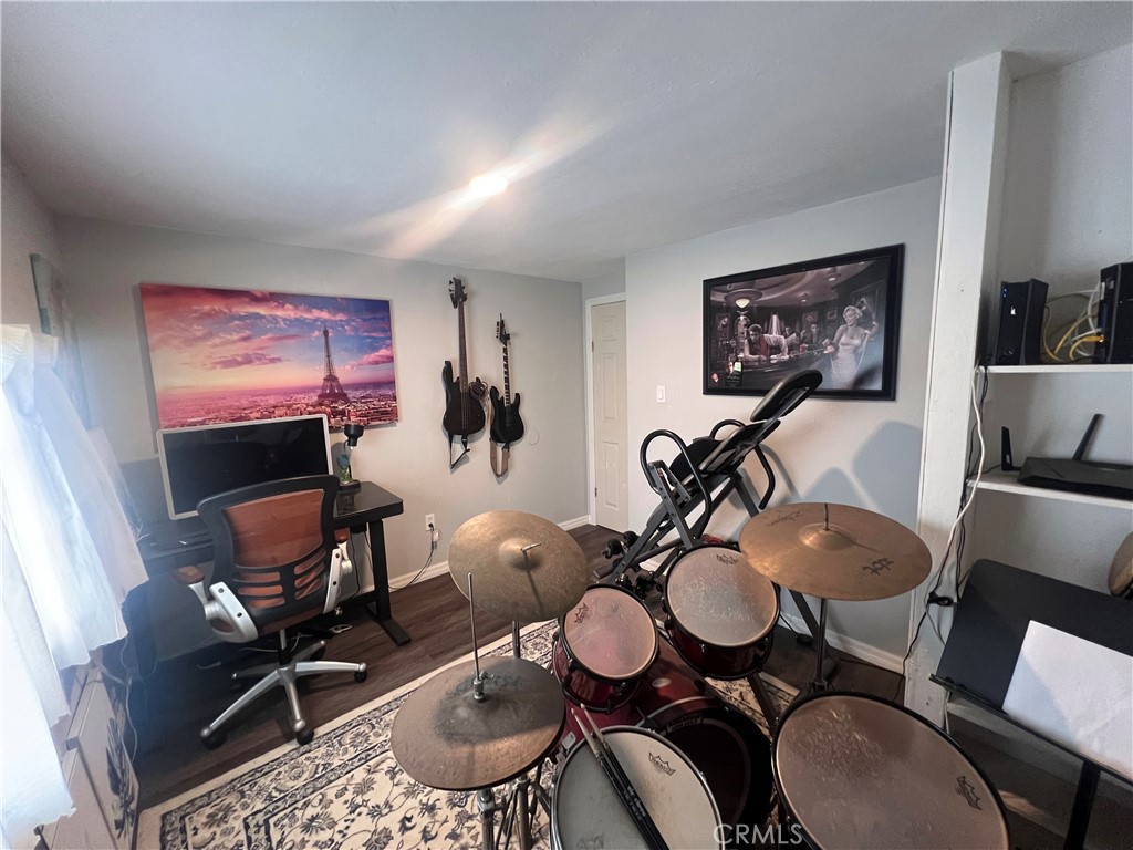 20415 Myron Street Perris, CA 92570 - Photo 8 of 29 a dining room with furniture a rug and a mirror