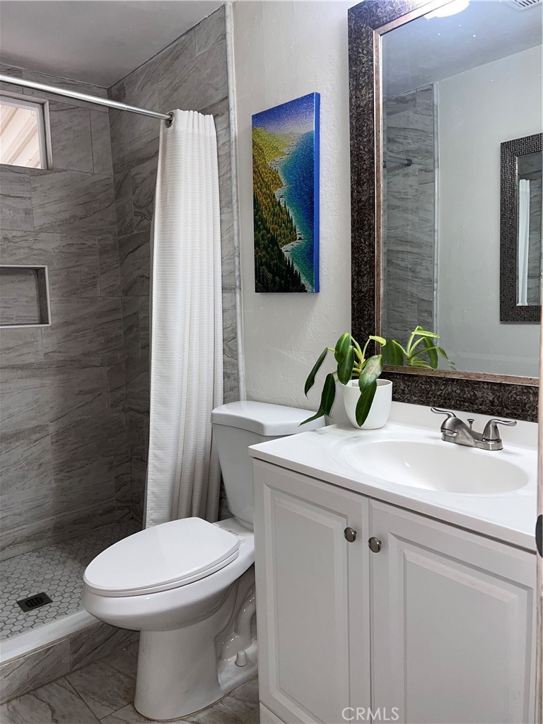 20415 Myron Street Perris, CA 92570 - Photo 9 of 29 a bathroom with a sink and a mirror