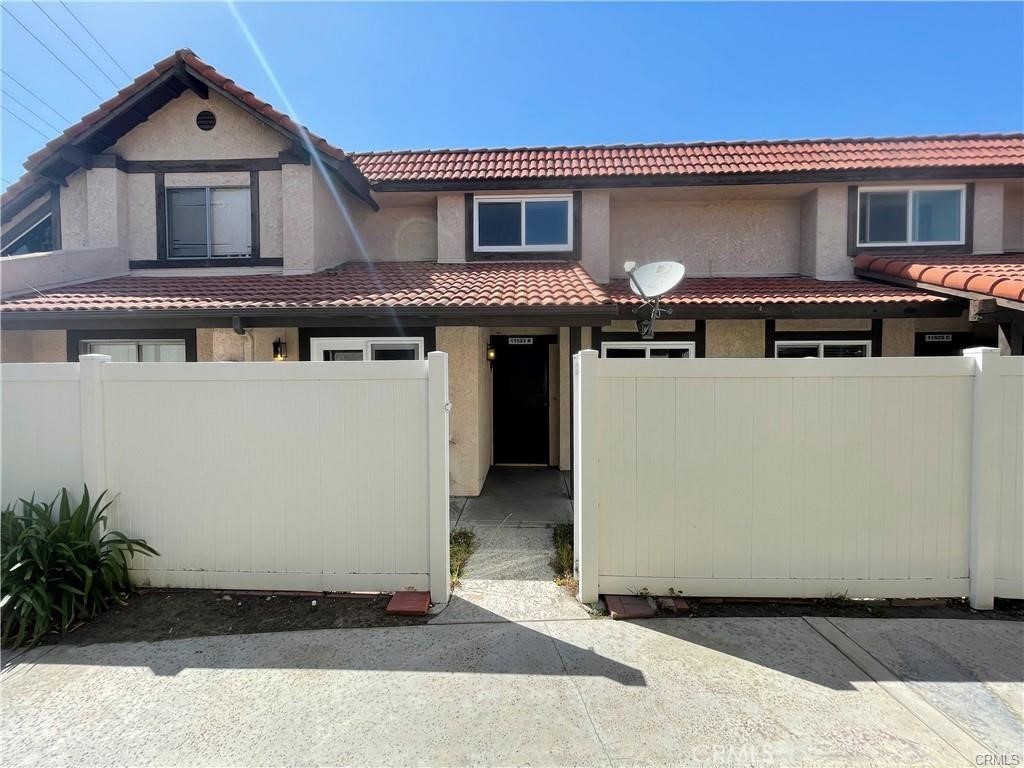 11523 Lower Azusa Road, Unit B El Monte, CA 91732 - Photo 1 of 1 a front view of a house with a yard