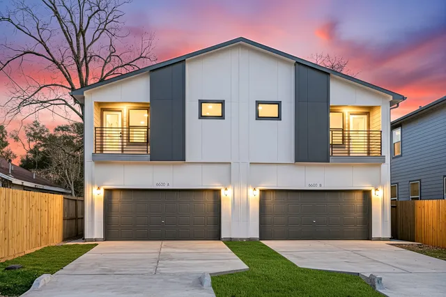 a front view of a house with yard