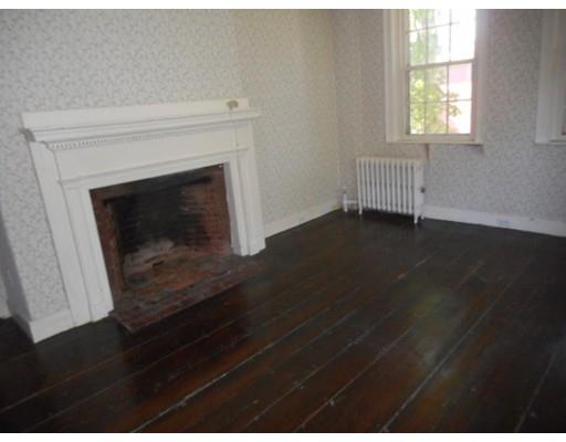 943 High Street Dedham, MA 02026 - Photo 11 of 25 a living room with a fireplace