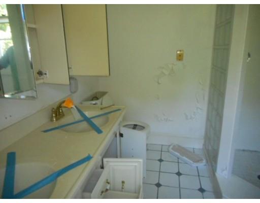 943 High Street Dedham, MA 02026 - Photo 12 of 25 a bathroom with a sink toilet and shower