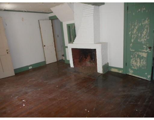 943 High Street Dedham, MA 02026 - Photo 13 of 25 a view of a livingroom with an empty space and a fireplace