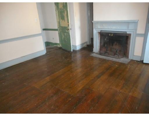 943 High Street Dedham, MA 02026 - Photo 15 of 25 a view of empty room with fireplace and wooden floor