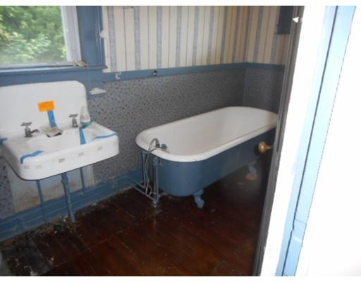 943 High Street Dedham, MA 02026 - Photo 16 of 25 a bathroom with a sink and a window