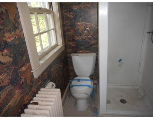 943 High Street Dedham, MA 02026 - Photo 19 of 25 a bathroom with a toilet and a shower