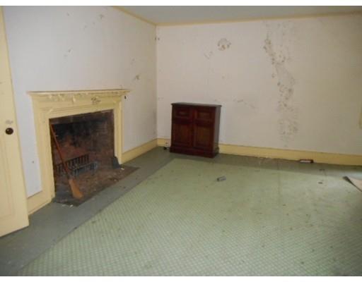 943 High Street Dedham, MA 02026 - Photo 24 of 25 a view of an empty room with a fireplace