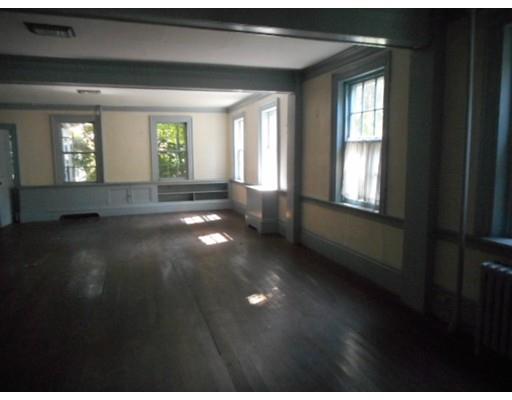 943 High Street Dedham, MA 02026 - Photo 5 of 25 a view of empty room with wooden floor and fan