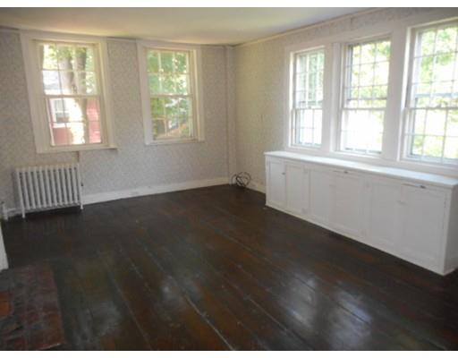 943 High Street Dedham, MA 02026 - Photo 10 of 25 a view of an empty room with wooden floor and a window