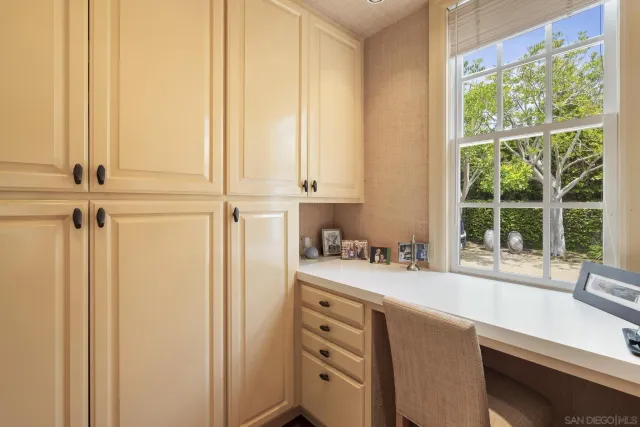 a kitchen with stainless steel appliances granite countertop a sink and a window