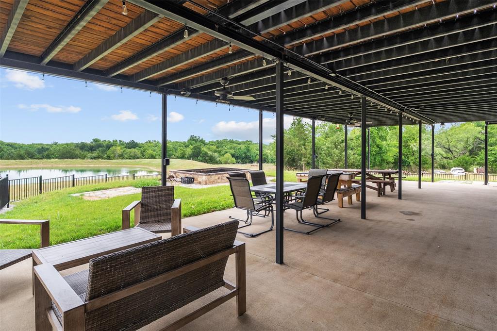 2129 Hcr 3322 Loop Hubbard, TX 76648 - Photo 32 of 38 Relax in the shade in the 60 ft long covered porch!