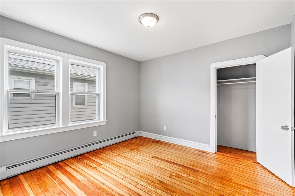 100 Weetamoe Street Fall River, MA 02720 - Photo 11 of 42 a view of an empty room with wooden floor and a window