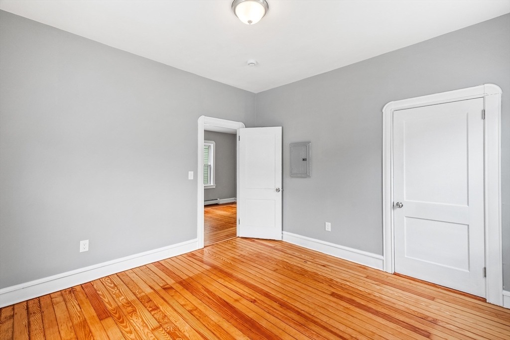 100 Weetamoe Street Fall River, MA 02720 - Photo 17 of 42 a view of empty room with wooden floor