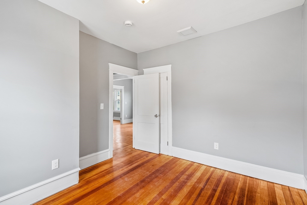 100 Weetamoe Street Fall River, MA 02720 - Photo 19 of 42 a view of an empty room and wooden floor