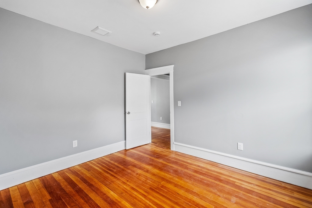 100 Weetamoe Street Fall River, MA 02720 - Photo 21 of 42 a view of empty room with wooden floor