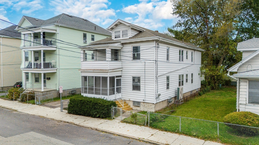 100 Weetamoe Street Fall River, MA 02720 - Photo 3 of 42 front view of a house with a yard