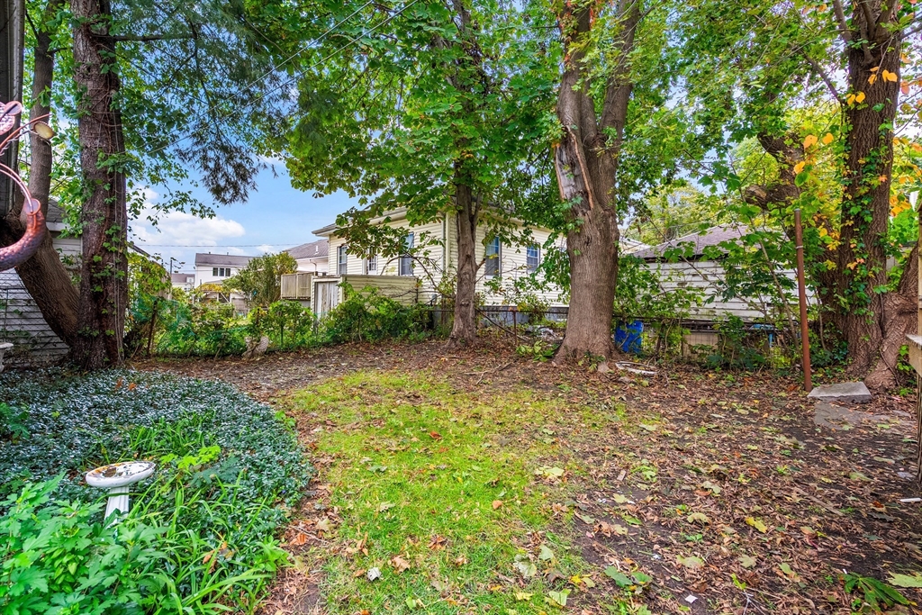 100 Weetamoe Street Fall River, MA 02720 - Photo 34 of 42 a backyard of a house with lots of green space