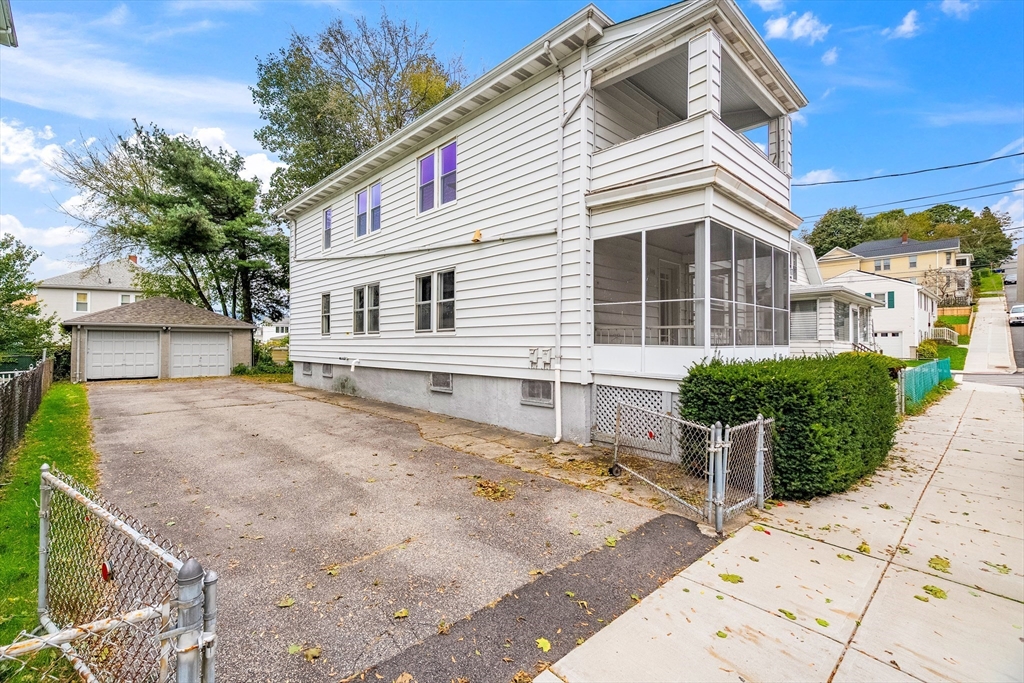 100 Weetamoe Street Fall River, MA 02720 - Photo 39 of 42 a front view of a house with a yard