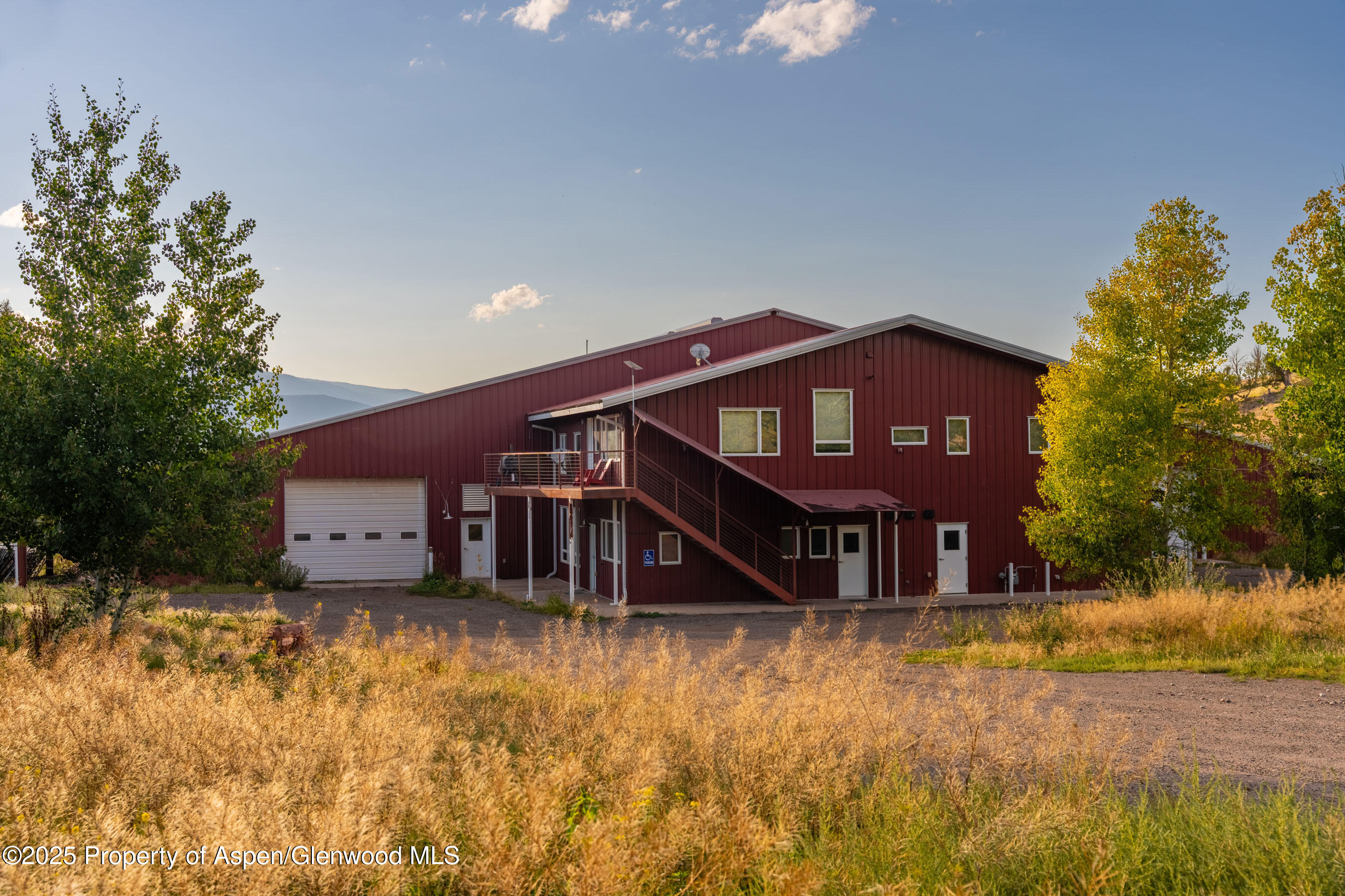 1644 Prince Creek Road Carbondale, CO 81623 - Photo 28 of 80 a front view of a house with a yard and large tree