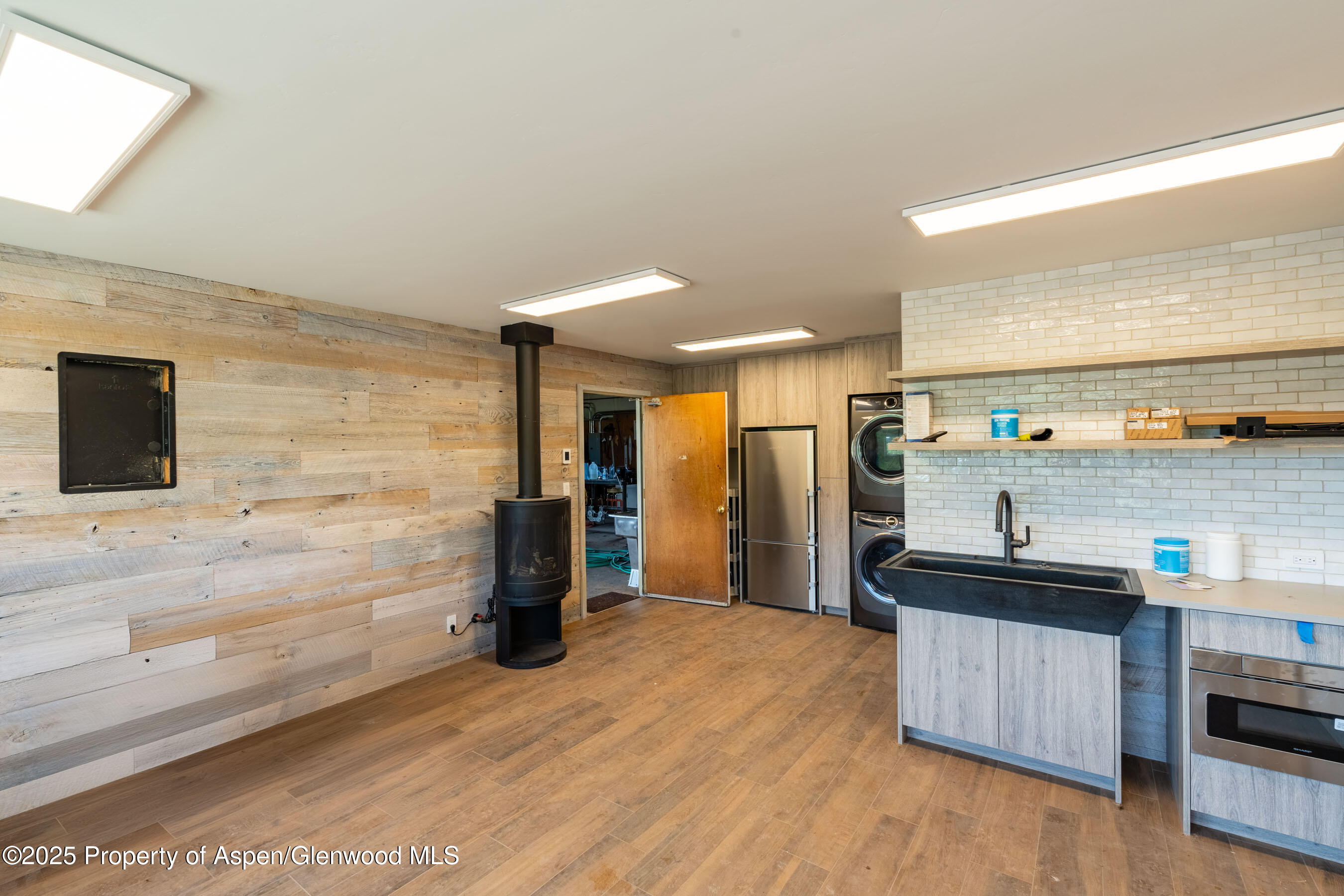 1644 Prince Creek Road Carbondale, CO 81623 - Photo 43 of 80 a kitchen with stainless steel appliances kitchen island granite countertop a refrigerator and a stove top oven