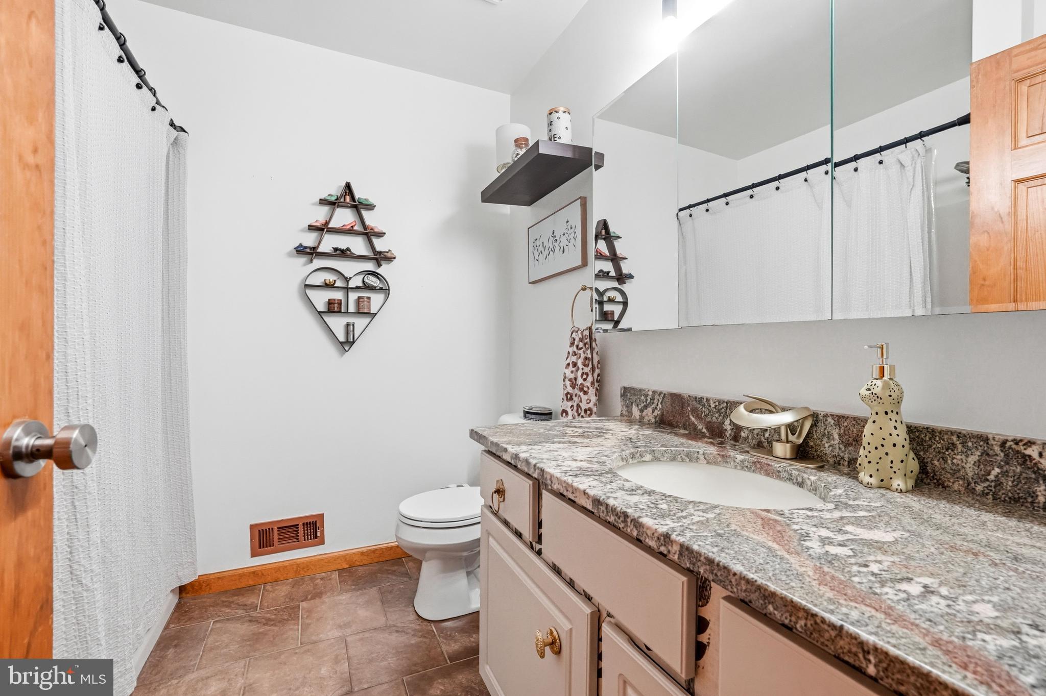 705 Garden Road Pittsgrove, NJ 08318 - Photo 32 of 72 a bathroom with a granite countertop sink and a mirror