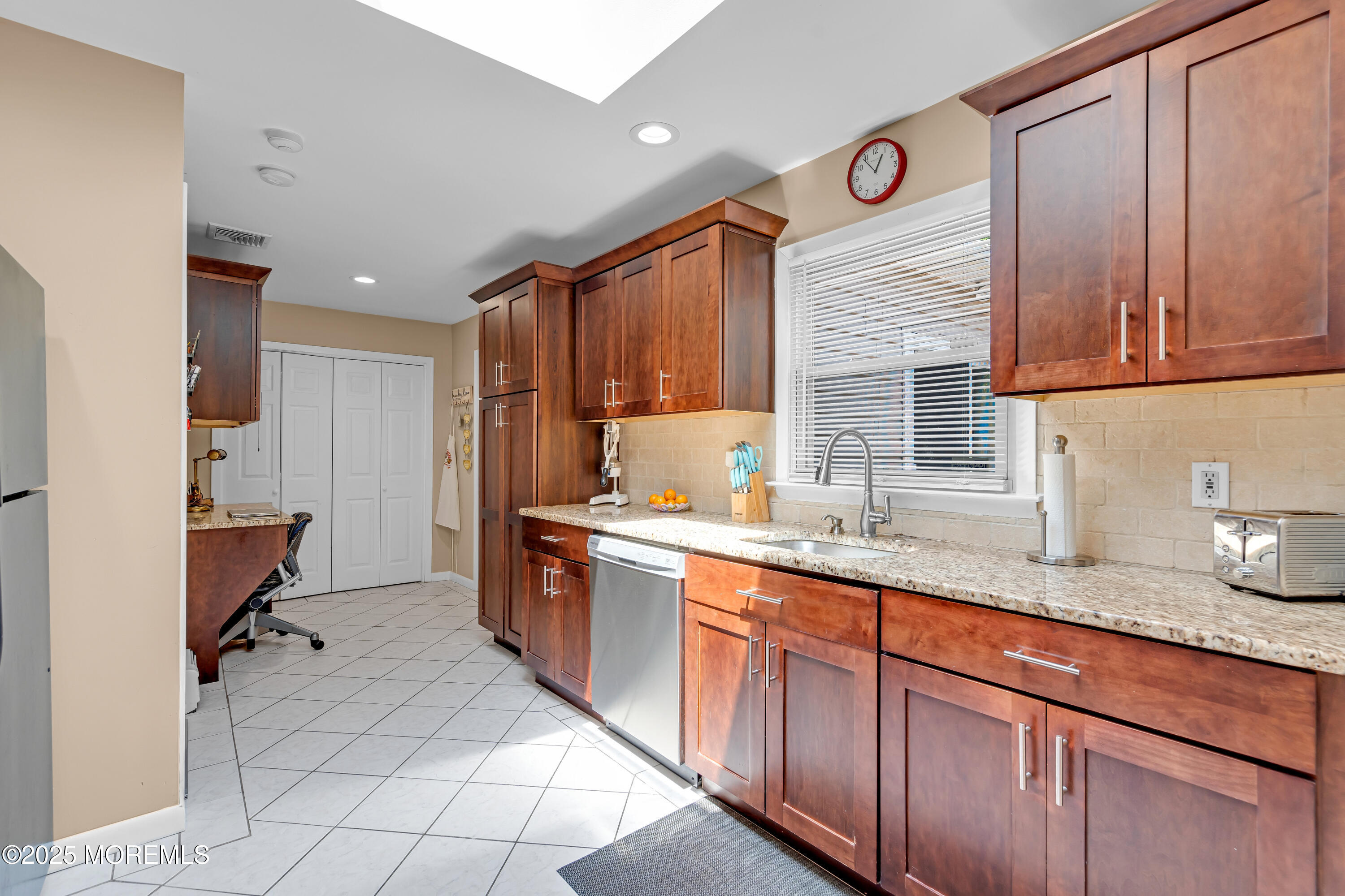 810 Devon Street Forked River, NJ 08731 - Photo 18 of 43 a kitchen with stainless steel appliances granite countertop a sink stove and cabinets