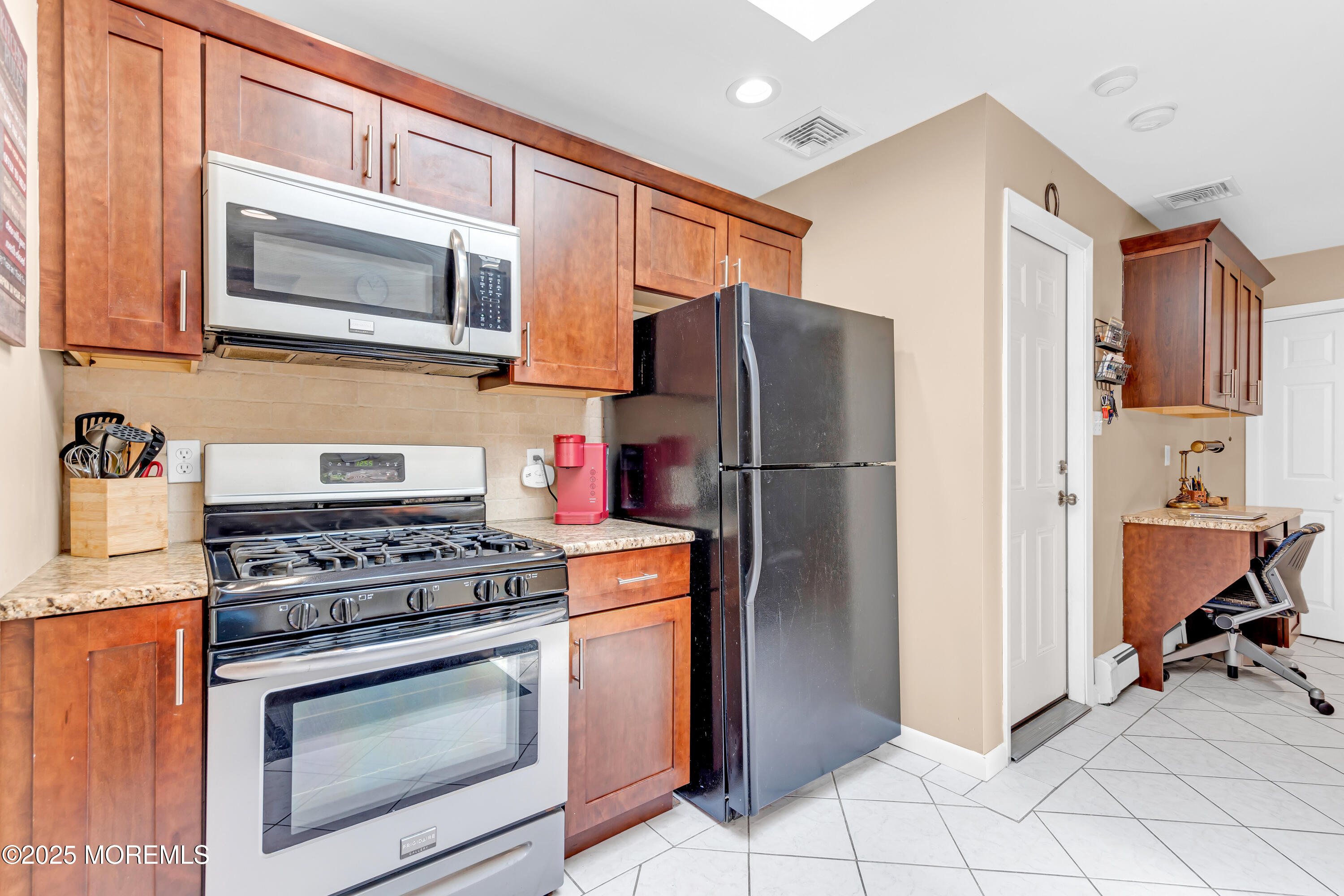 810 Devon Street Forked River, NJ 08731 - Photo 19 of 43 a kitchen with stainless steel appliances granite countertop a refrigerator stove and sink