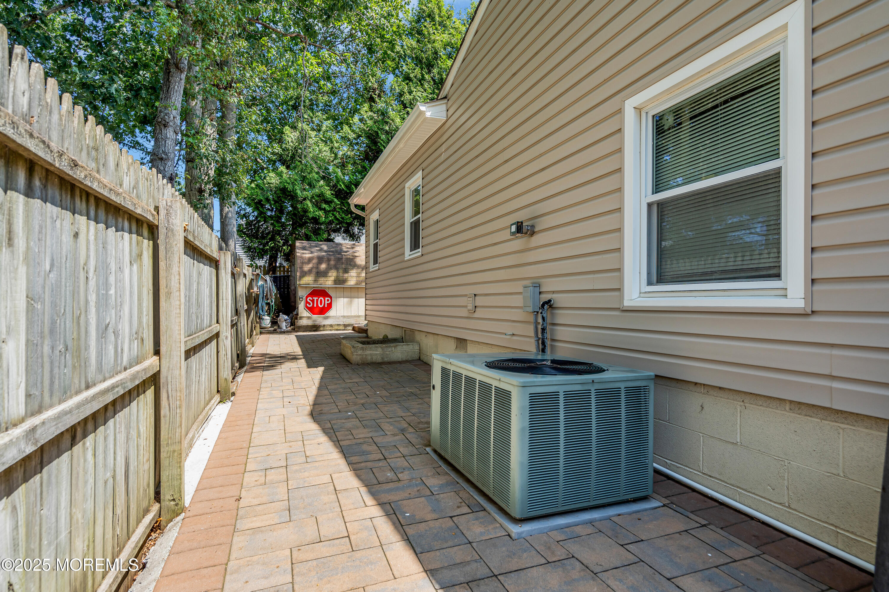 810 Devon Street Forked River, NJ 08731 - Photo 27 of 43 a view of a patio with table and chairs and wooden fence