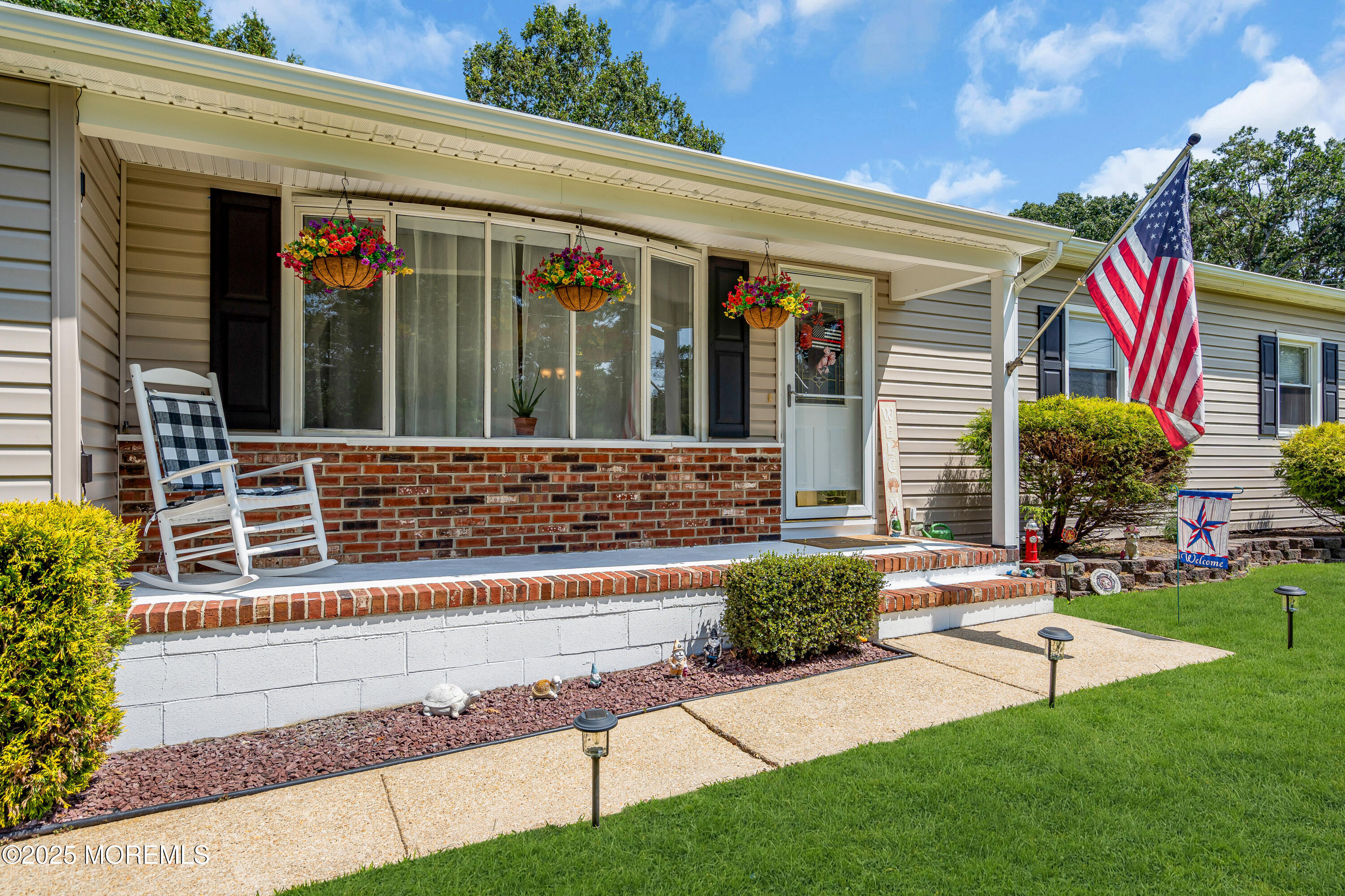 810 Devon Street Forked River, NJ 08731 - Photo 5 of 43 a view of a house with a small yard and a patio