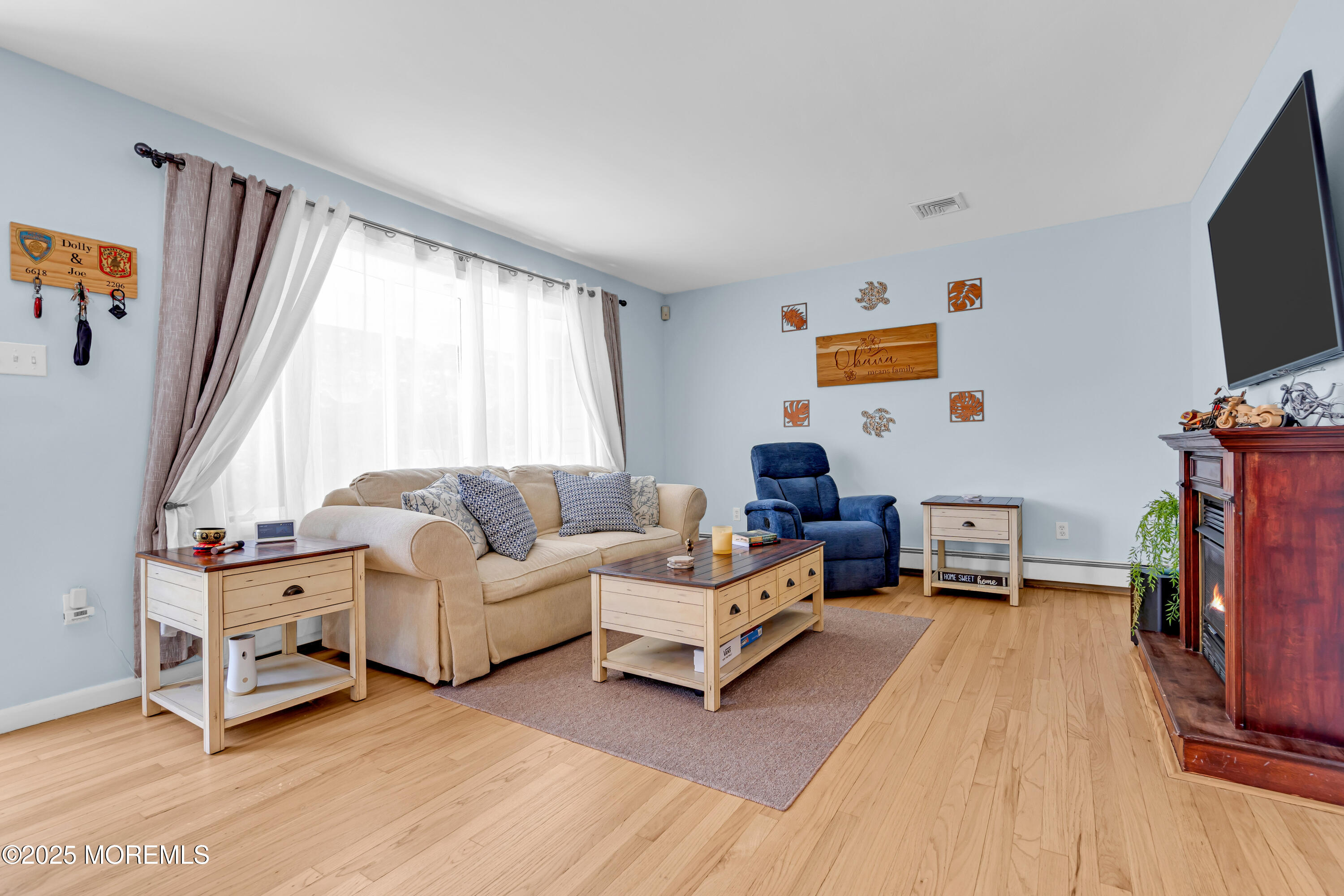 810 Devon Street Forked River, NJ 08731 - Photo 8 of 43 a living room with furniture and a flat screen tv