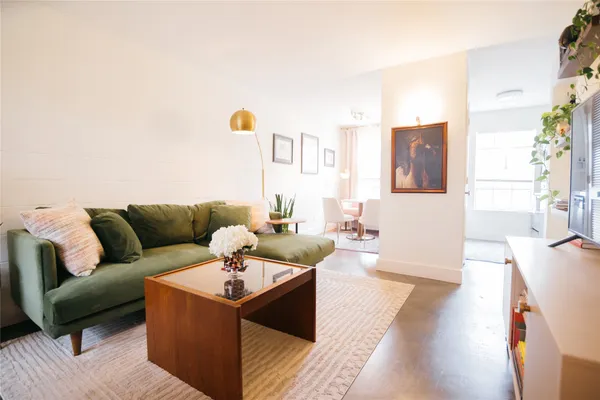 a living room with furniture and a table