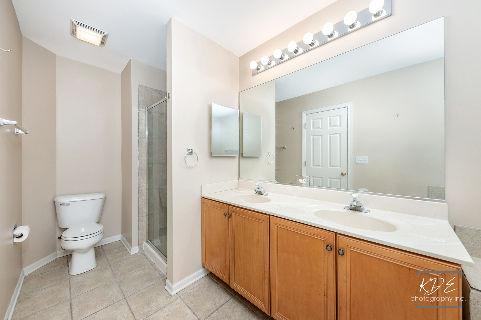 S044 Lee Court Winfield, IL 60190 - Photo 15 of 25 a bathroom with a toilet sink and mirror