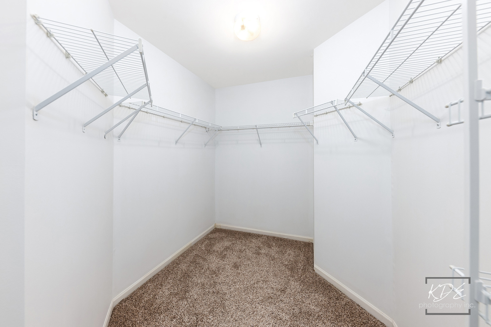 S044 Lee Court Winfield, IL 60190 - Photo 16 of 25 a view of a room with racks on the wall