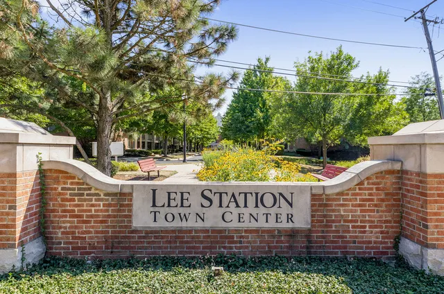 a front view of a house with swimming pool and outdoor seating