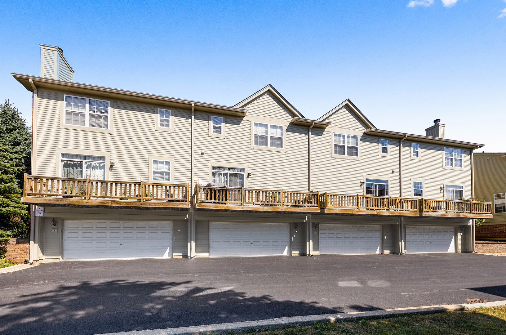 S044 Lee Court Winfield, IL 60190 - Photo 25 of 25 a front view of a house with swimming pool and outdoor seating