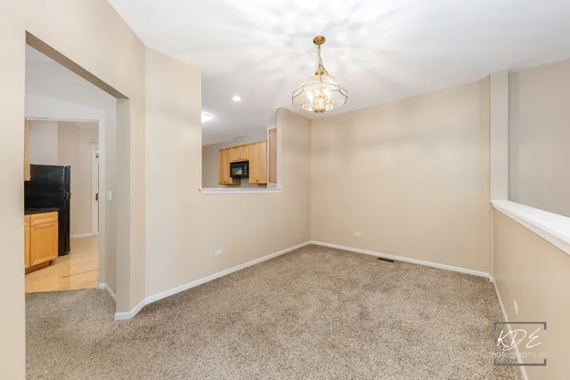 an empty room with windows and entrance