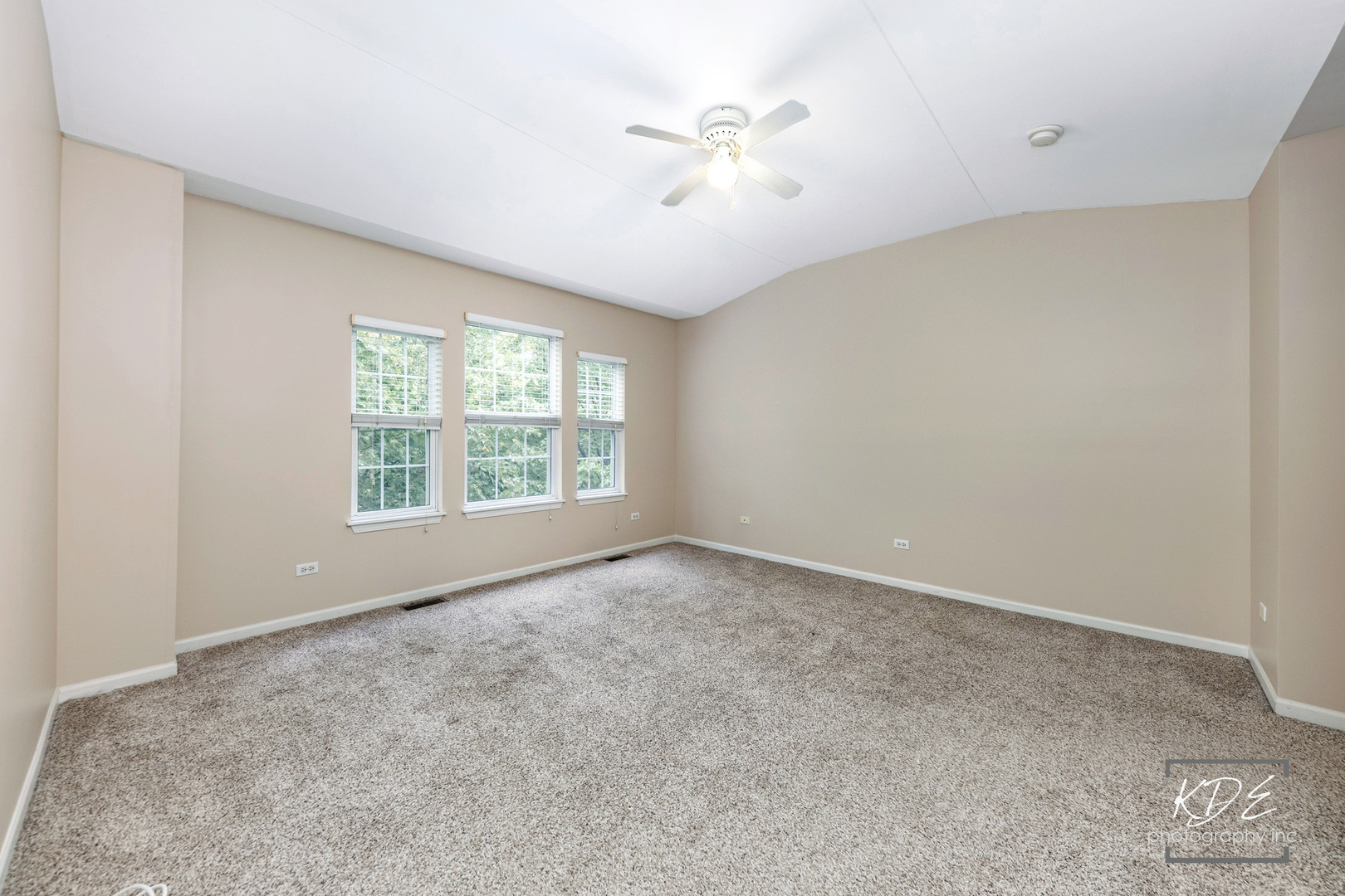 S044 Lee Court Winfield, IL 60190 - Photo 10 of 25 an empty room with windows and ceiling fan view