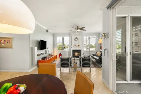 a kitchen with stainless steel appliances granite countertop a sink refrigerator and cabinets