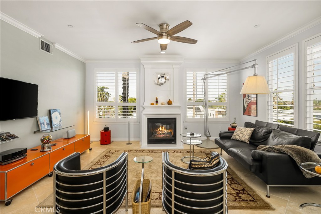 1000 East Ocean Boulevard, Unit 613 Long Beach, CA 90802 - Photo 14 of 65 a living room with furniture a fireplace and a large window